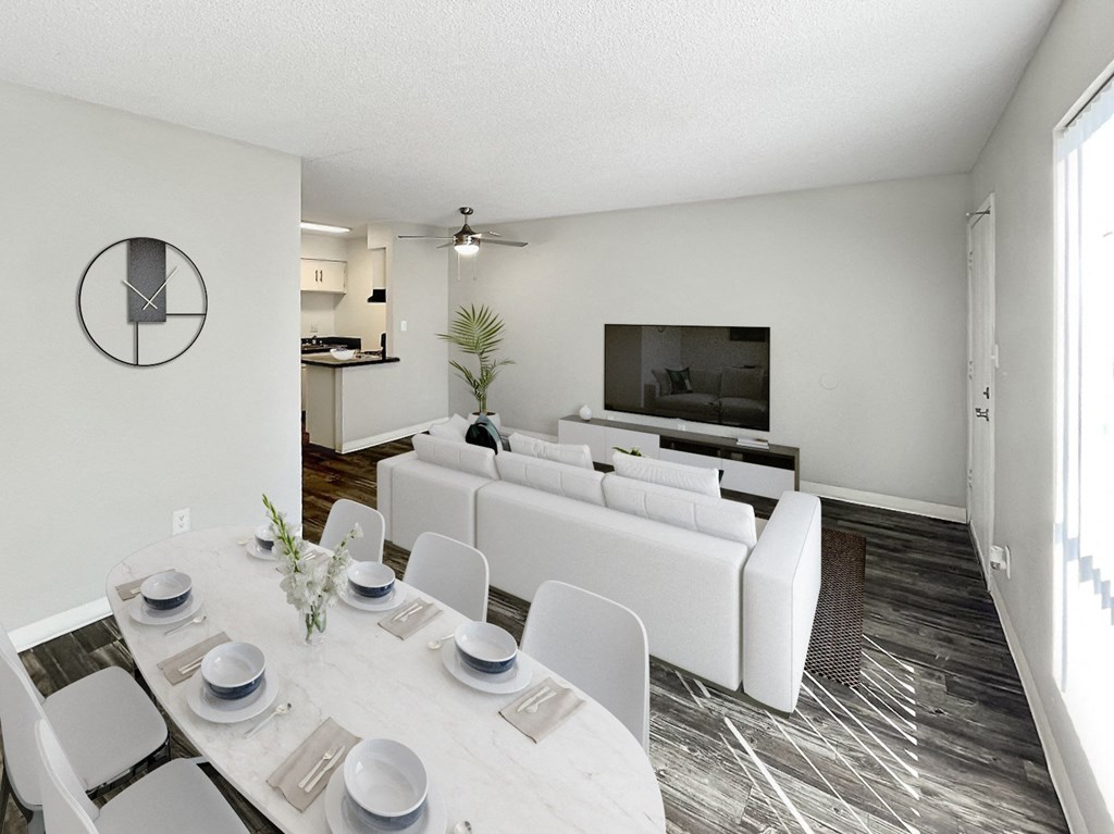 A modern dining room with a white table set for six.